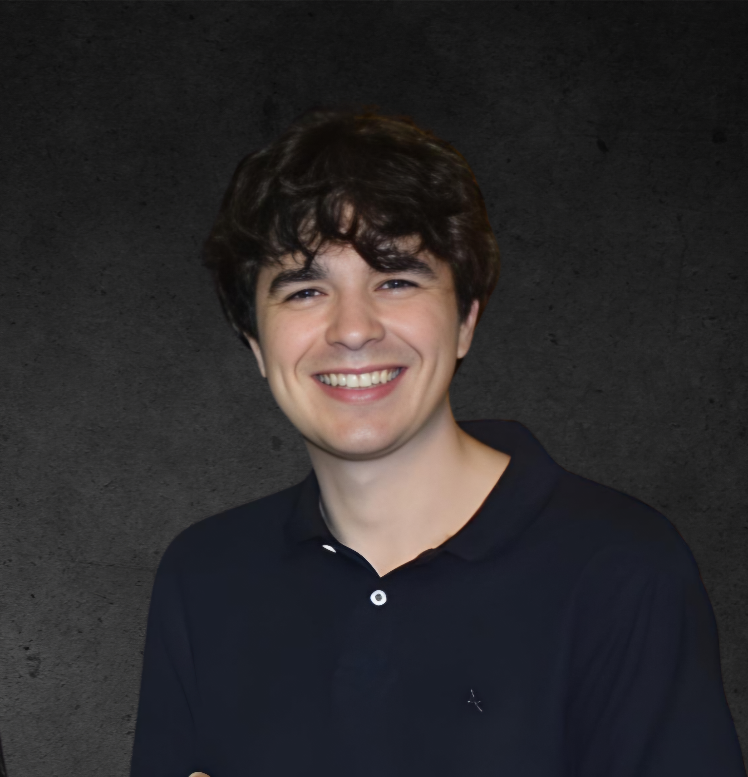 Professional headshot of Jaime, technical architect and lead developer at Arkatype Studios, against a modern architectural backdrop